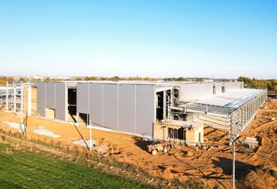 The shell of a new warehouse on a greenfield site